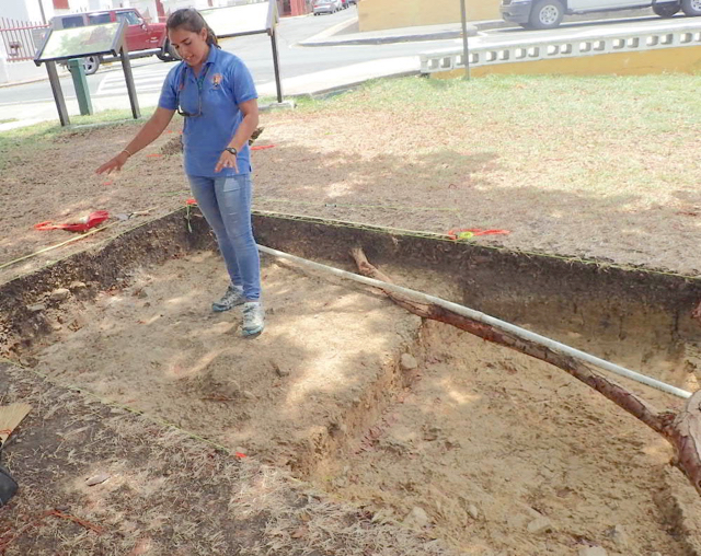 Michelle Gray, of the NPS Southeast Archeological Center points out features of one of the excavations at the Christiansted National Historic Site.
