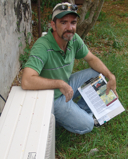 Brian Daley with the business end of the library's split air-conditioning unit.