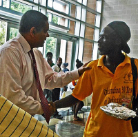 Gov. John deJongh Jr. (left) greets a client. Gov. John deJongh Jr. (left) greets a client.