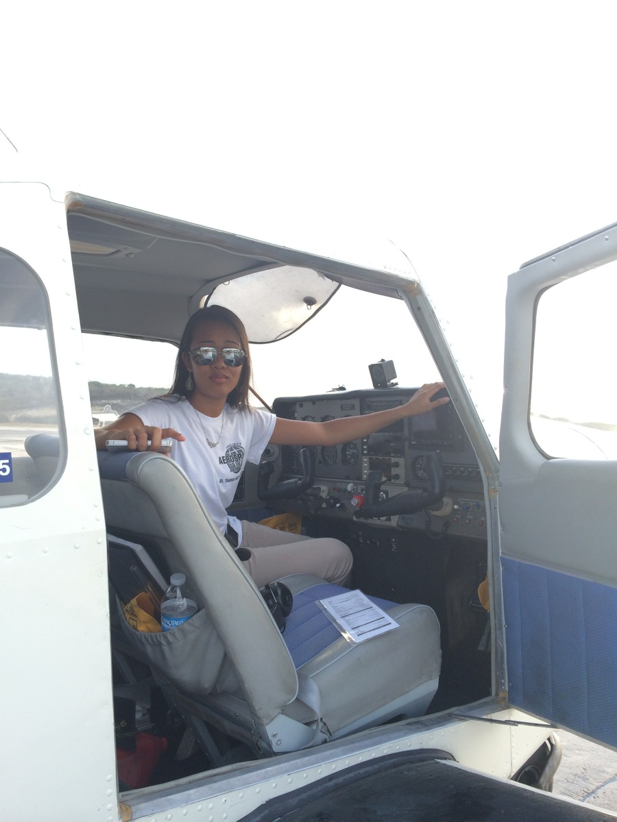 Regine Rose Acosta in a Beechcraft Musketeer aircraft 