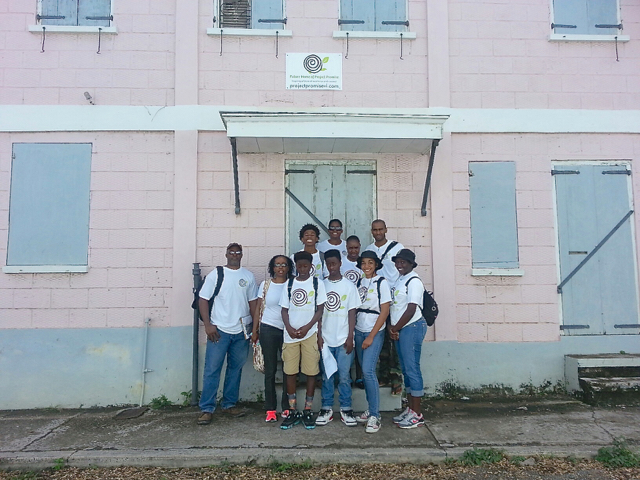 Student volunteers that picked up community assessments standing in front of the Project Promise building. (Photo by Erica Parsons)