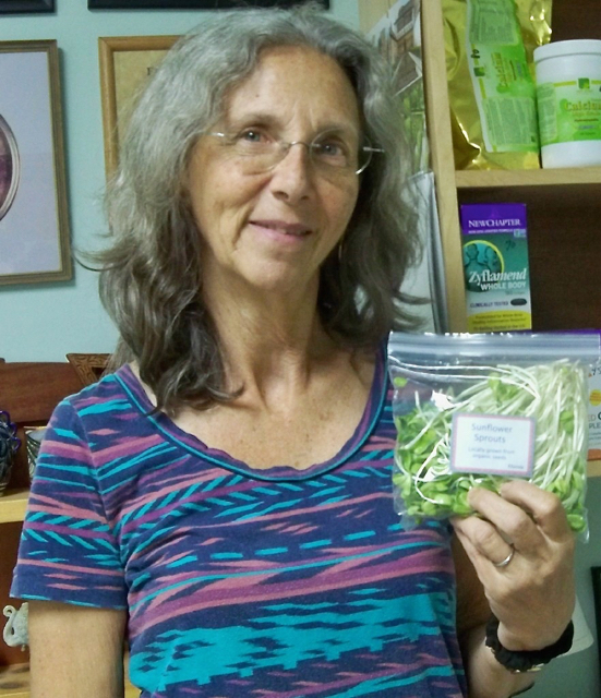 Rhonda Pessin holds a bag of her sunflower sprouts. 