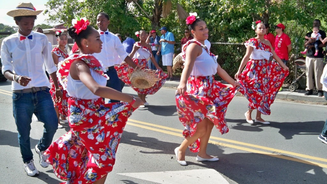 Ballet Folklorico Dominicano dancers delight the crowd lining the parade route Sunday down Christiansted's King Street.