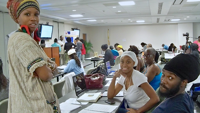 Crystal Eubanks, left, Charmaine Gumbs, Earlene Wagner, and Dwane Honore discuss Gumbs' plan to start a bed and breakfast.