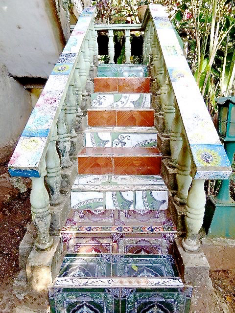 Whimsically painted stairs lead to the home of artist Mario Pelegrin.