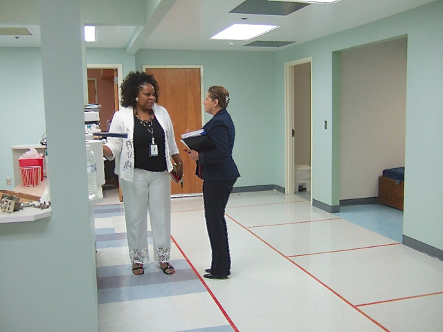 Chief Medical Officer Mavis Matthew discusses renovations to the mental health area with Justa Encarnacion, chief nursing officer at JFL.