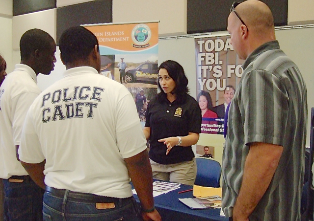 An FBI representative talks to police cadets about careers with the bureau during Monday's Career Fair at UVI. (Susan Ellis photo)