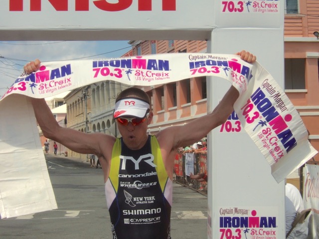 Matt Chrabot crossed the finish line in first place in his first St. Croix 70.3 Ironman.