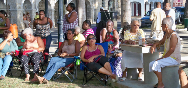 Crowd relaxes and enjoys the music at Quelbe at Sunset in Frederiksted's Vernon I. Richards Veterans Park.