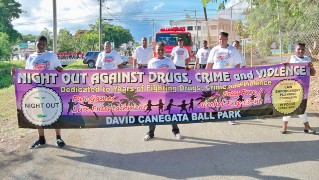 Local youth lead the National Night Out Against Drugs, Crime and Violence March.