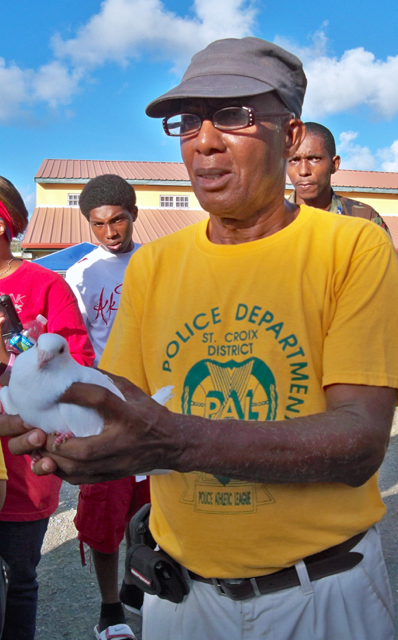 Renholdt 'Rookie' Jackson prepares to release a dove. 