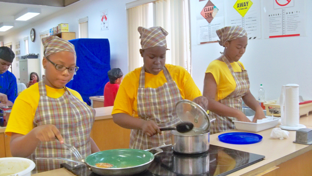 Thai-Lee Missick, left, Nyana Francois and Laurie Cedeno, Elena Christian students, compete in the 'Super Chef' competition.