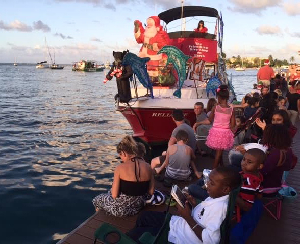 Here comes Santa Claus! The St Croix Ultimate Bluewater Adventures boat leads the parade.