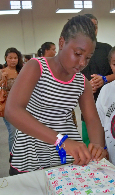 Teairra James, 9-years-old, shows her winning style at gift wrapping.