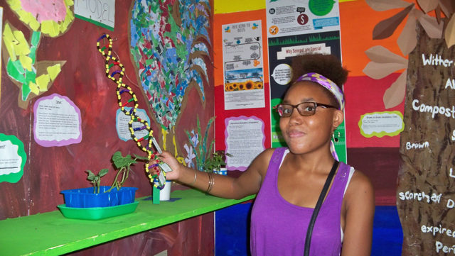 Layla Bradshaw, eighth-grade student at GHCD, shows DNA model.