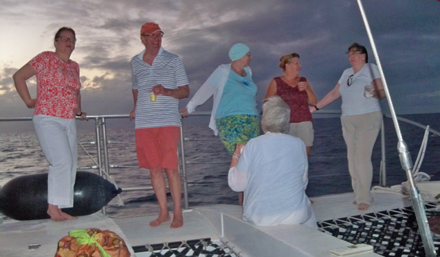 Passengers enjoy a twilight cruise on Jolly Mon.