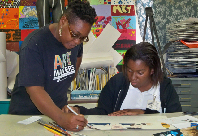 Niarus Walker advices art student Kiana Alexander, a senior at Central High.