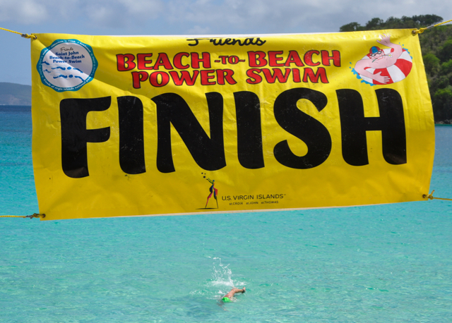 A participant in Sunday&rsquo;s Beach to Beach Power Swim approaches the finish line at Hawksnest Bay.