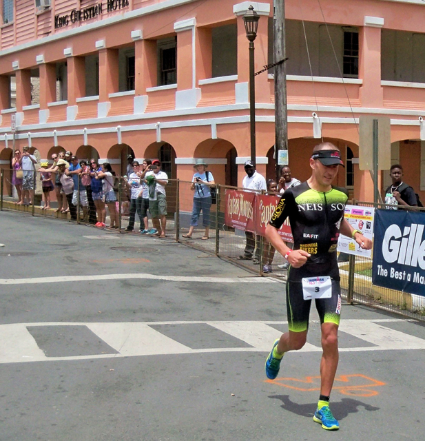Franchy Favre approaches the finish line in first place Sunday at the St. Croix Ironman.