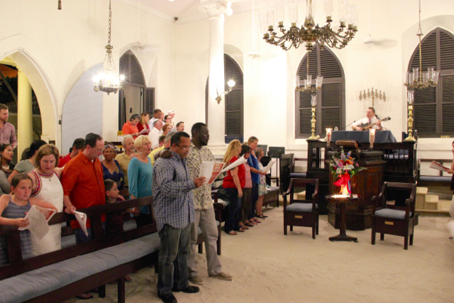 Community members Friday at the Hebrew Congregation of St. Thomas honor and mourn the victims of the Orlando shooting.