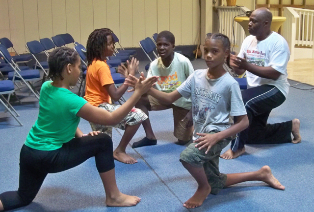 From left, J'Neelah Daniel, Jahmani Graham, Ricardo Caleb and Ezekiel Williams learn Capoeira under the direction of Rudy O'Reilly.