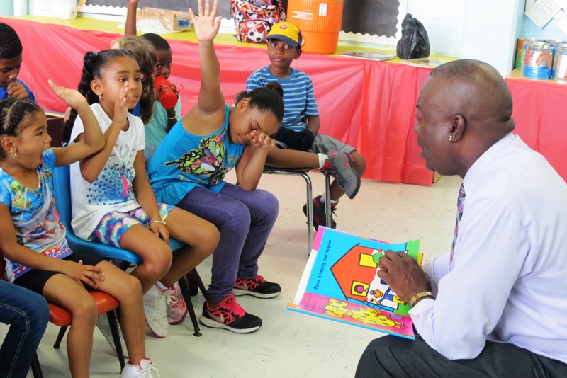  Lt. Gov. Osbert Potter reading to children at Juanita Gardine Elementary