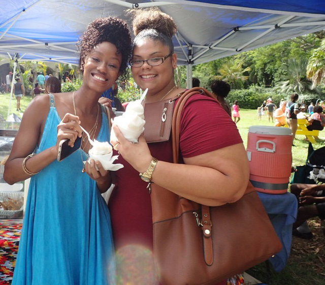 Tamisha Barry and Kyminis Vialet enjoy coconut sorbet from Love Croix Helados at  Mango Melee Sunday.