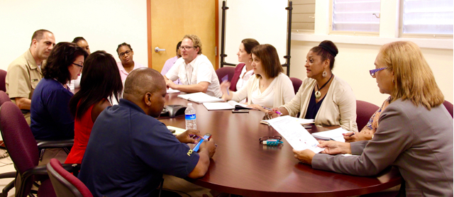 Teams member from multiple branches of the Zika response effort come together for a daily morning meeting to be briefed on the situation.