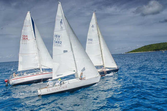 Three boats battle in the St. Croix Regatta. (Photo by Emelyn Morris-Sayre)