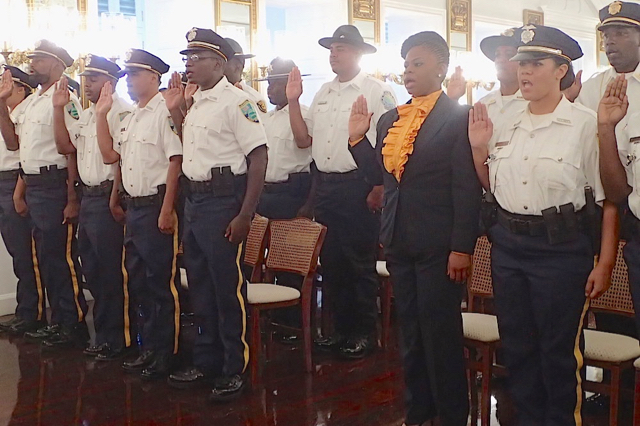 Graduates from the V.I. Police Academy are sworn in during Monday's graduation ceremony at Government House in Christiansted.