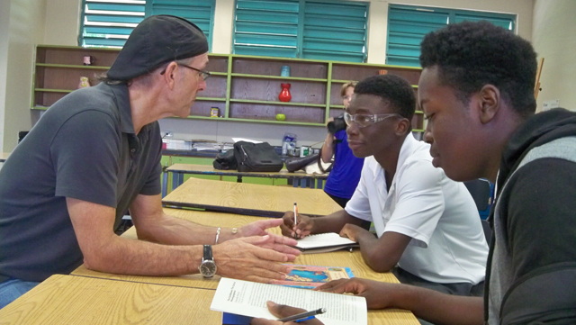 Complex students Tyrone Reed, center, and Jahmoi Benjamin interview author Mario Pacayo.