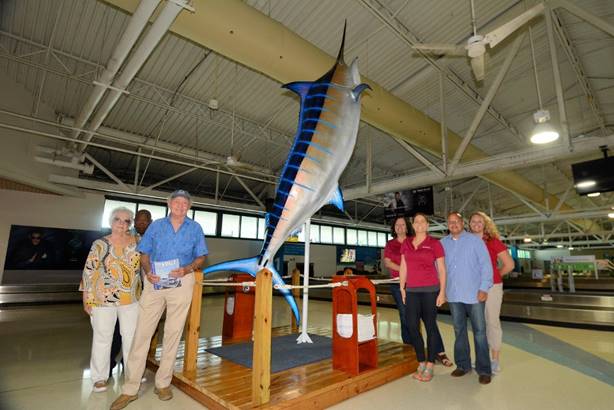 (L to R) Addie Ottley (WSTA radio personality who assisted in the project), Sue Boland (MVP board member), Jimmy Loveland (USVI Open/Atlantic Blue Marlin Tournament director and MVP founder who spearheaded the effort), Meme St. John (Crowley Logistics and Warehouse manager), Melanie Bell (Crowley Customer Service), Jose Nazario (Cyril E. King Airport manager), Jennifer Morales (Crowley Caribbean Service manager. (Credit - Dean Barnes)  