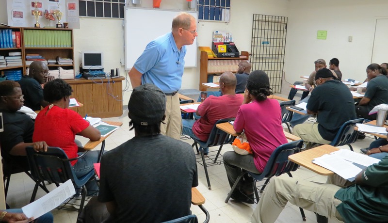 Johnny Purvis, retired UCA professor, tells participants how to watch their backs during professional development training for school monitors at CHS gym.