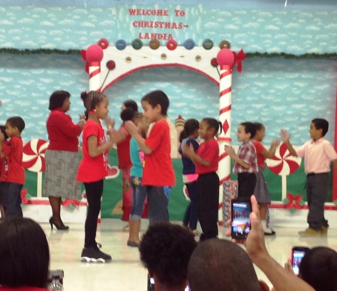 Alfredo Andrews School first grade students play and sing Jingle Bells at Christmaslandia 