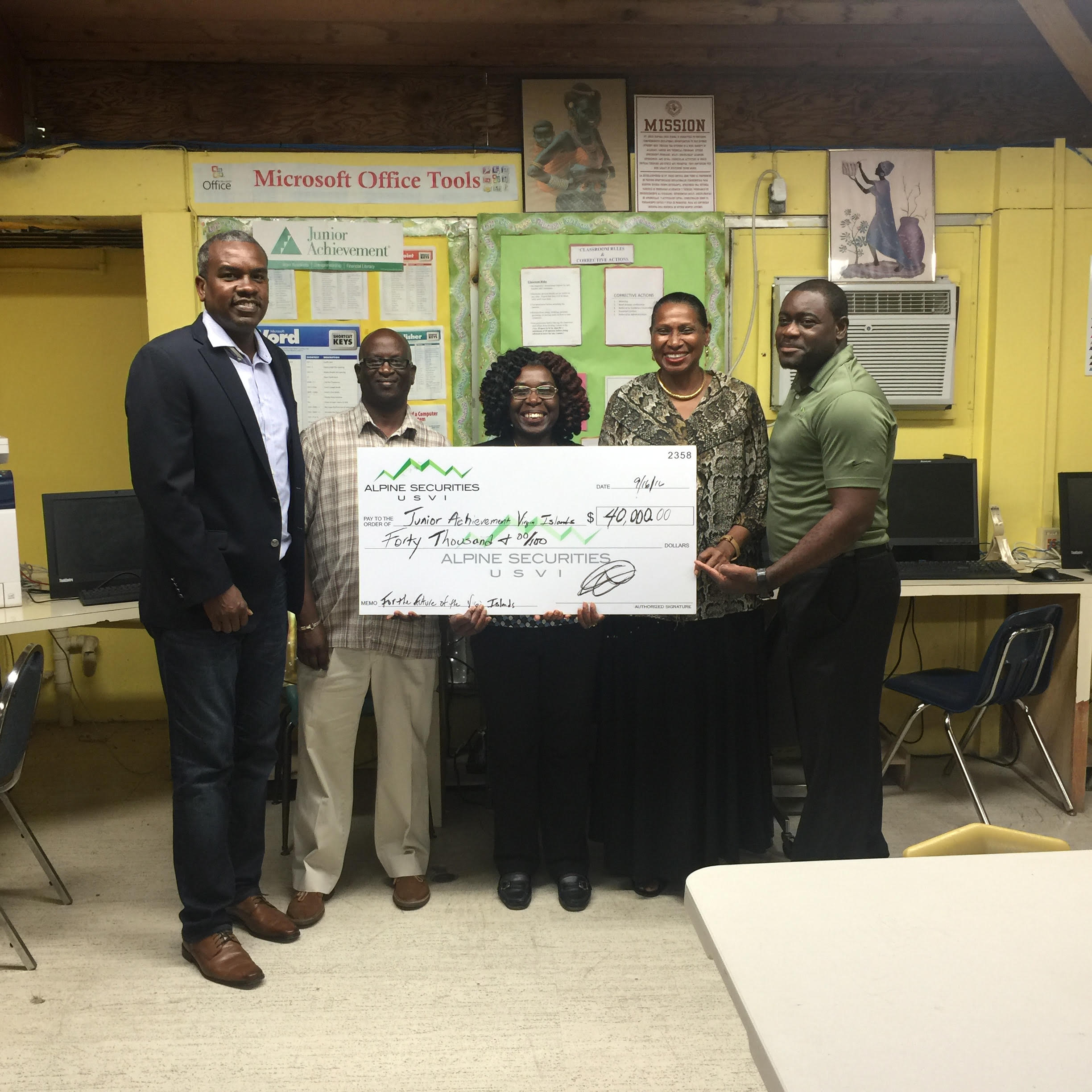 Albert Bryan Jr., Junior Achievement executive director; Janasee Sinclair, Central High School principal; Joy Anne Norman, business chair CHS; Vaughn Hewitt, deputy superintendent of St. Croix schools