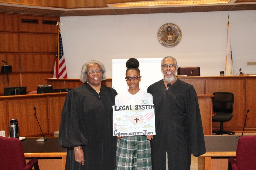 (L to R) Chief Judge Wilma A. Lewis; first-place winner in the St. Croix Division, Tara Serrant; Magistrate Judge George W. Cannon Jr.