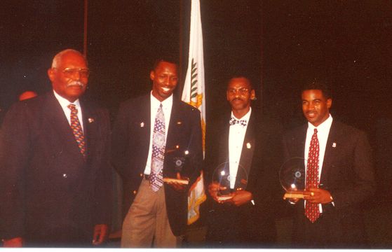  R to L Derry Pemberton, Neville Hodge, Keith Smith. Edgar Isles, then president of the Virgin Islands Olympic Committee, presents the award at the VIOC Banquet at Frenchmans Reef (Photo by Wallace Williams, VITFF)