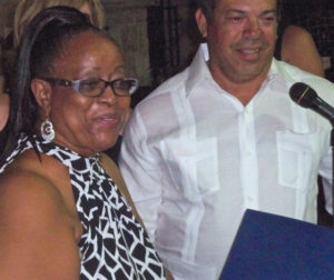 Anastacia Rivers, with master of ceremonies Edgar Bengoa, receives her award for new business of the year.