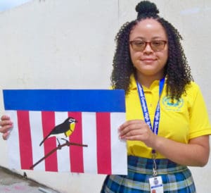 Bianca Alexis displays the flag she designed for Make Your Mark.