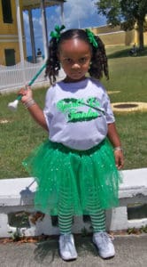 3-year-old Ne’Kyla Hazel is ready with her baton.