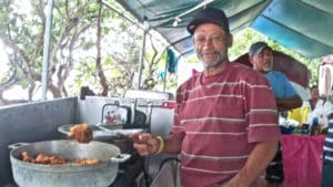 Roman Colon fries chicken at Altona Lagoon camp site.