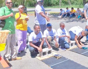 Energy Office Director Elmo Roebuck Jr., standing left, and former director Bevan Smith Jr., standing right, oversee the Solar Spring. Smith worked the original Solar Sprint, and volunteered to help at this one.