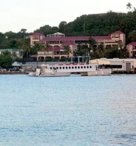 The ferry QE IV glides into Gallows Bay.