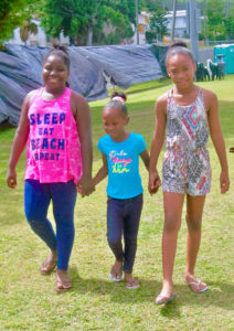 From left, Kiara Lionel, Aaniyra Lionel and Azarah Almestica walk a few laps Sunday during the Relay for Life. The girls were part of the team from Viya.