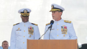 Adm. William Moran, right, turns over command of the littoral combat ship USS Gabrielle Giffords to Cmdr. Keith Woodley Saturday in Galveston, Texas. 