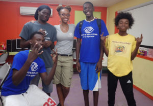 Junior Scientists in the Sea members Andy Christian, Saeed Phillips, Devonte Stevens, Elijah Thomas with Boys and Girls Club team development coordinator Thailia Rodrigues.