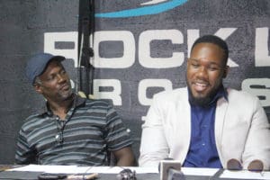 Trainer David Rogers, Sr. gives V.I. boxer Clayton Laurent, Jr. some support during Wednesday’s news conference.