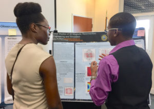 Photo caption 2: Student Peter Jean-Baptiste tells professor Verleen McSween about his project on 3D magnetic reconnection.