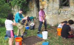 Students take part in the archeological dig, from left, Tara Vizzi, Peyton Rayne, Thomas Baker and seat right, Mackenzie Wood and Nico Bonetta Misteli. (Photo by Steve Lenik)