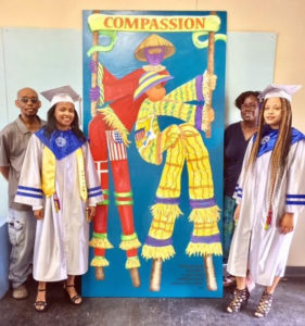 From left, Dwaydale Dariah, Zaquira Carri, Bianca Alexis, Danica David at the St. Croix Educational Complex High School. The school's National Art Honor Society students designed the second Barra Virtue Mocko Jumbie mural. Alexis and Carri were among those who completed the project. (Photo by Talisa Alexis)